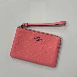 coach pink small embossed leather wristlet